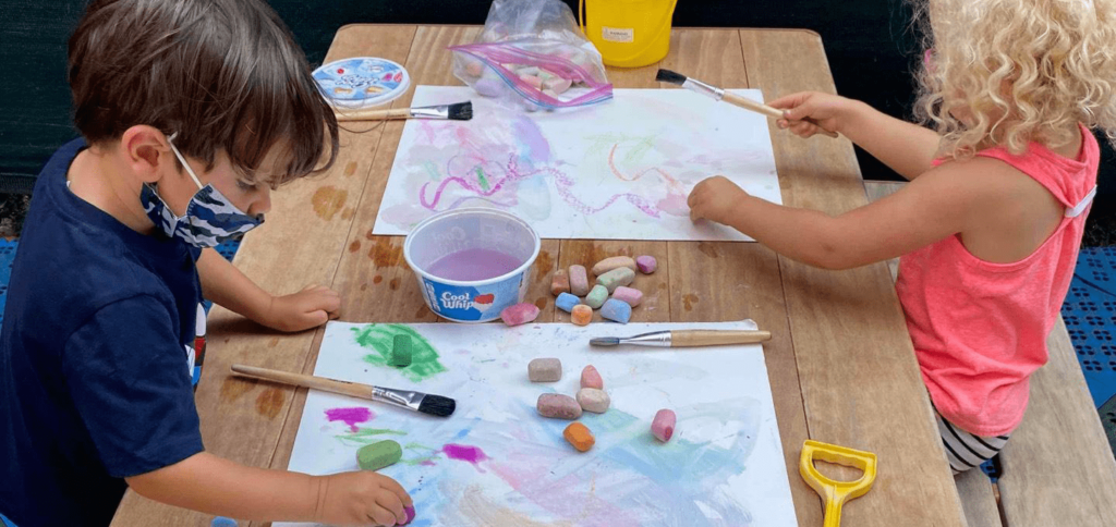 mount carmel two children painting outside